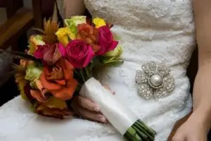 bride wearing a diamond brooch