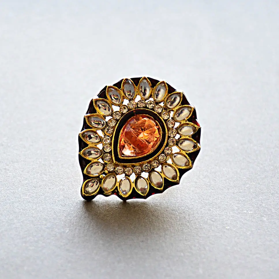 a gold ring surrounded with diamonds