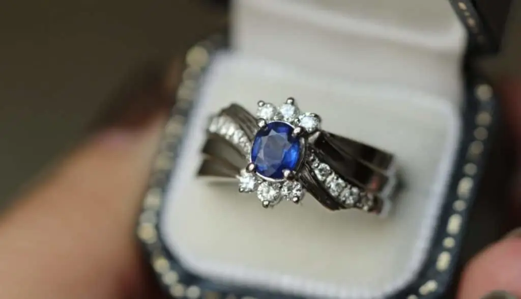 Sapphires surrounded by smaller diamonds on a ring