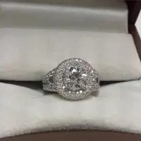 halo shaped diamond ring surrounded by smaller diamonds