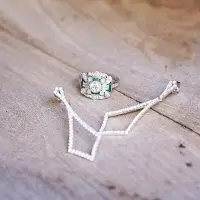 diamond earrings and emerald ring