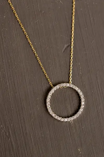 diamond circle pendant on a gold chain