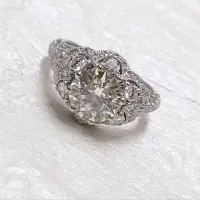 large diamond surround by smaller diamonds ring