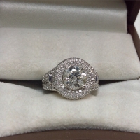 2 carat halo diamond engagement ring in a white ring box 