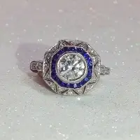 antique octagon sapphire and diamond right-hand ring with sparkly white background