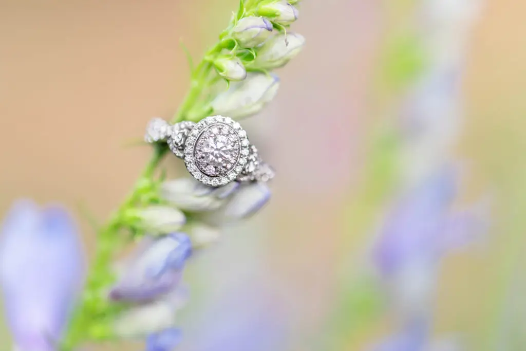 A diamond ring displayed on a snapdragon flower that is part of our Custom Jewelry Process