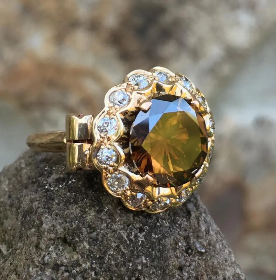 a fancy orange brown diamond with antique retro mounting is a perfect right hand ring