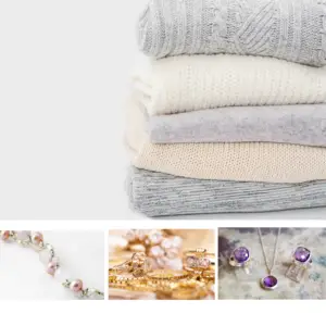 a stack of white and ivory sweaters with pearls, gold chains, and gemstones under it showing the best jewelry to wear in winter