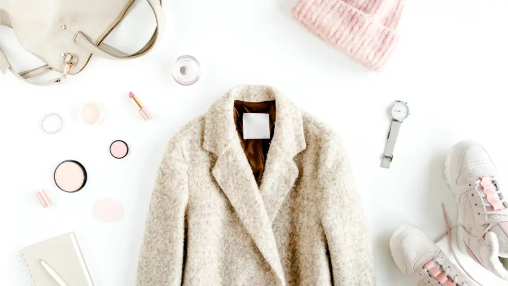 a collage of winter clothing in white and neutrals with jewelry on a white background