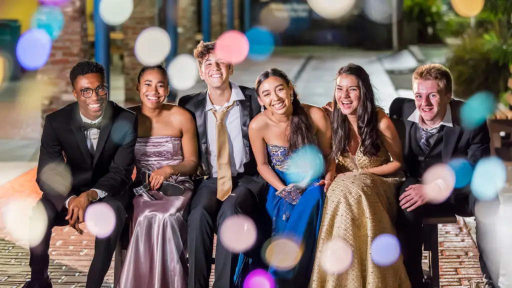 A group of teenagers at prom wearing their prom jewelry