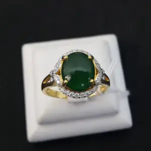 a green jade ring in yellow gold with diamond surround to wear on St. Patrick's Day