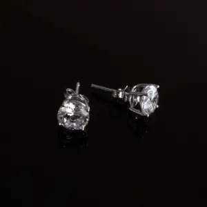 A pair of diamond stud earrings with a black background for Mother's day jewelry ideas