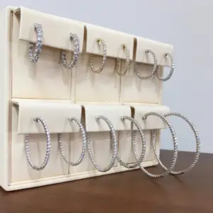 A selection of different sized diamond hoop earrings