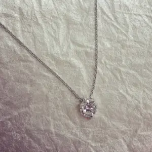 A diamond pendant necklace on a silver chain for Mother's Day Jewelry ideas