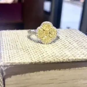 Canary Yellow diamond ring with 5 large yellow diamonds in center surrounded by white diamonds