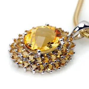 A large citrine gemstone pendant surrounded by smaller citrine gemstones