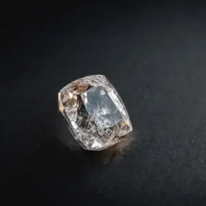 A white topaz gemstone on a black background