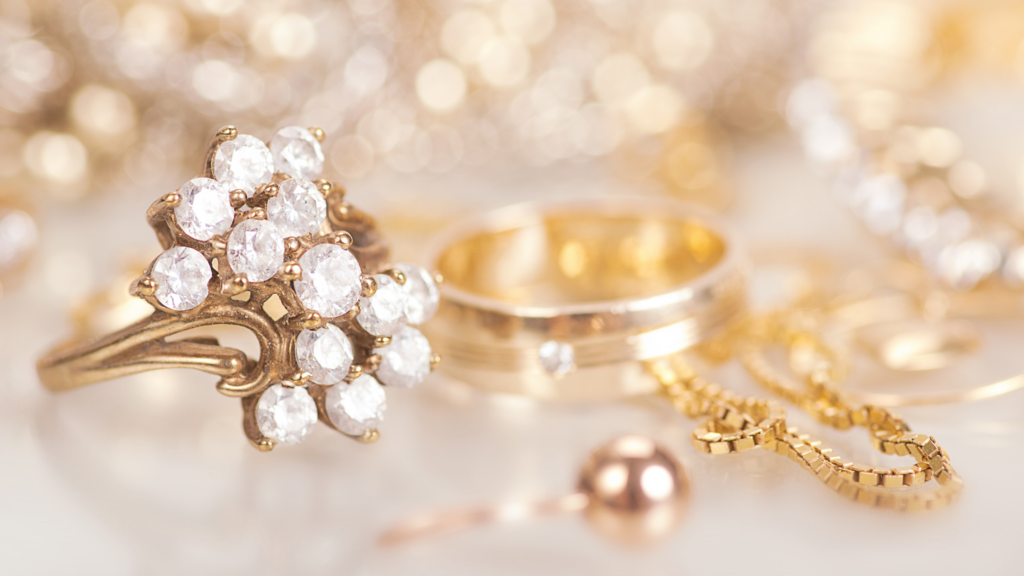 A collection of fine jewelry and fashion jewelry on a white table