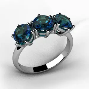 A 3 stone alexandrite gemstone ring in white gold