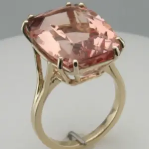 A morganite gemstone ring set in yellow gold