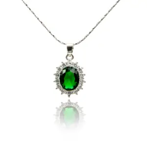 A large oval emerald pendant necklace on a white background