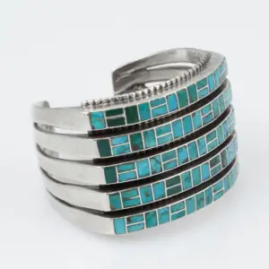 a cuff bracelet with turquoise gemstones