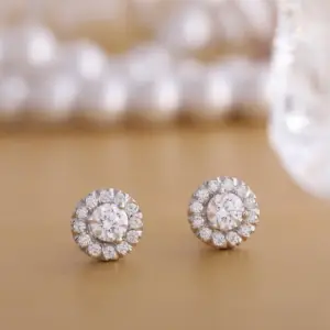 diamond stud earrings on a table