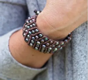 A leather and pearl cuff bracelet