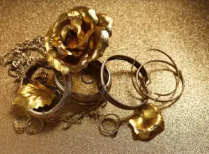 A mix of gold metal floral inspired jewelr